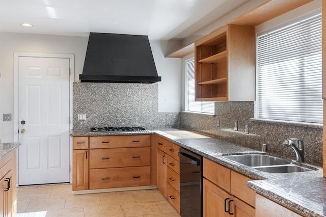 kitchen with wall chimney range hood, sink, dishwasher, backsplash, and stainless steel gas cooktop