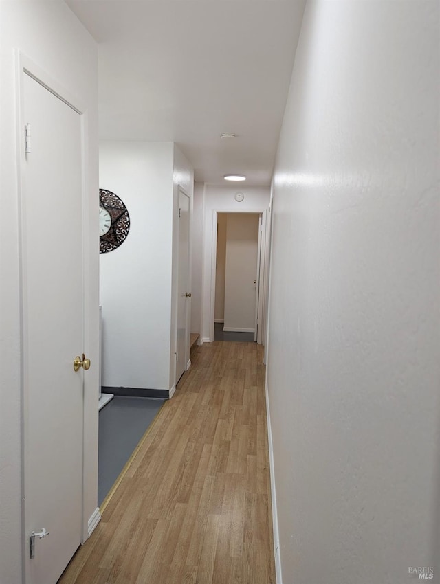 hallway featuring light hardwood / wood-style flooring