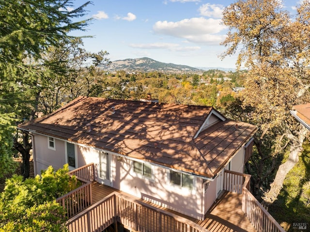 back of house with a deck with mountain view