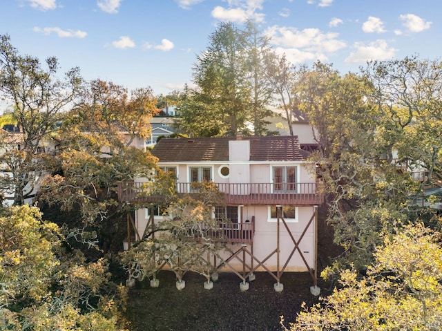 rear view of house featuring a balcony