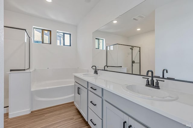 9005 Camino Colegio Rd, Rohnert Park, CA 94928 - kitchen with appliances with stainless steel finishes, a sink, light wood finished floors, an island with sink, and healthy amount of natural light