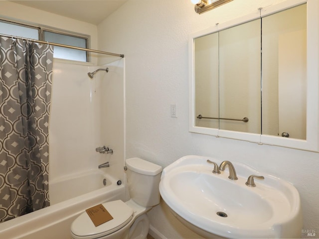 full bathroom featuring sink, shower / tub combo, and toilet