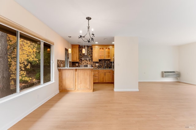 3473 Tice Creek Dr Unit 1, Walnut Creek, CA 94595 - kitchen with wall chimney exhaust hood, a chandelier, open floor plan, light wood-type flooring, and recessed lighting