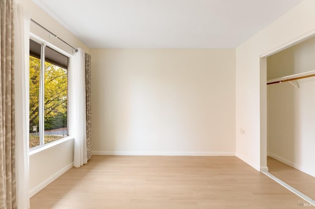 3473 Tice Creek Dr Unit 1, Walnut Creek, CA 94595 - unfurnished bedroom featuring light wood finished floors, baseboards, and a closet