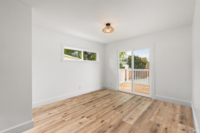 spare room featuring light wood-type flooring