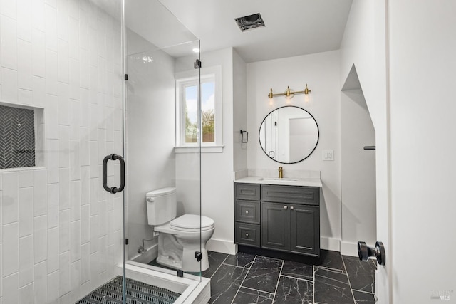 bathroom featuring walk in shower, vanity, and toilet