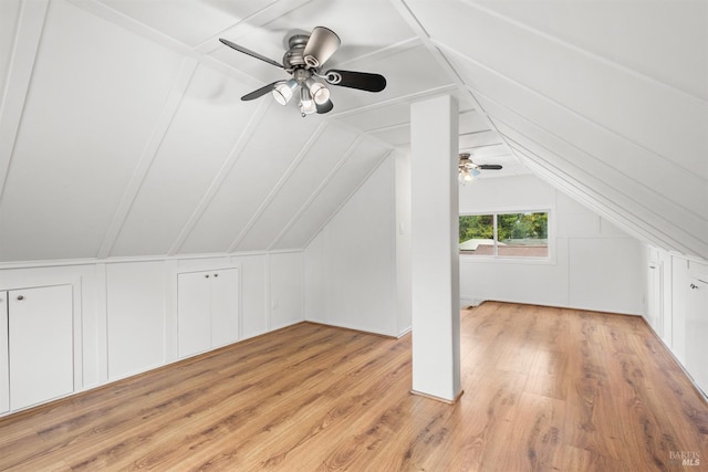 additional living space featuring light wood-type flooring, vaulted ceiling, and ceiling fan