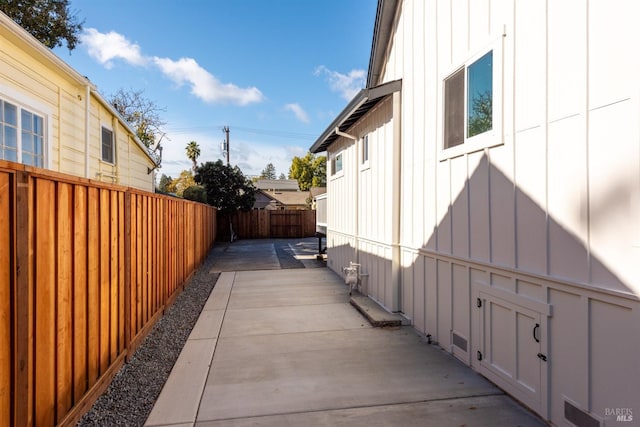 view of side of home featuring a patio