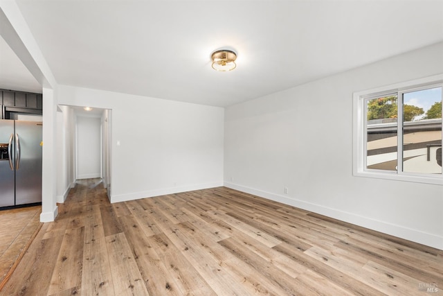 unfurnished room featuring light hardwood / wood-style floors