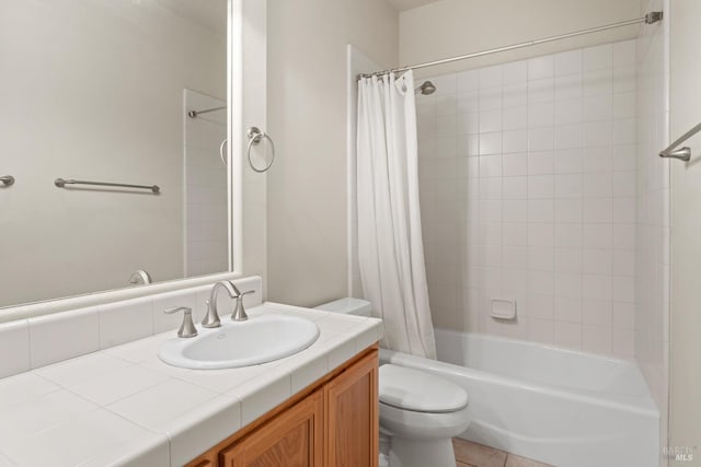 bathroom featuring shower / tub combo, vanity, toilet, and tile patterned floors