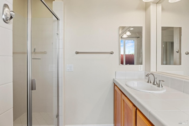 full bath featuring a shower stall and vanity