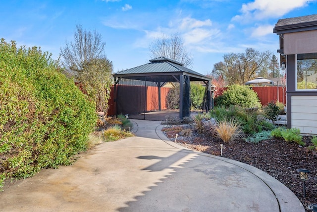 view of patio / terrace featuring fence and a gazebo