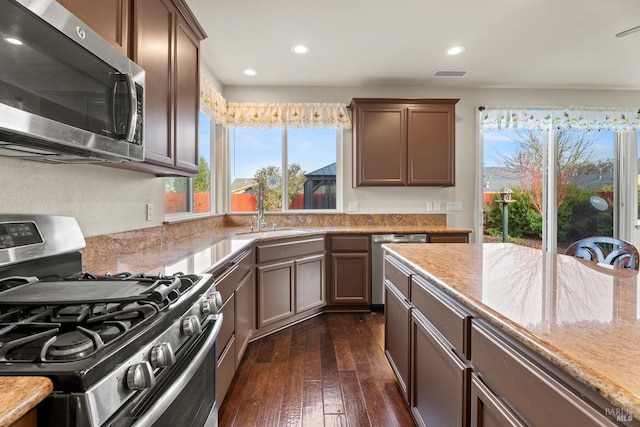 kitchen featuring recessed lighting, a sink, visible vents, appliances with stainless steel finishes, and dark wood-style floors