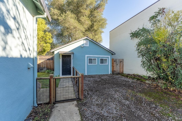 view of home's exterior featuring an outbuilding