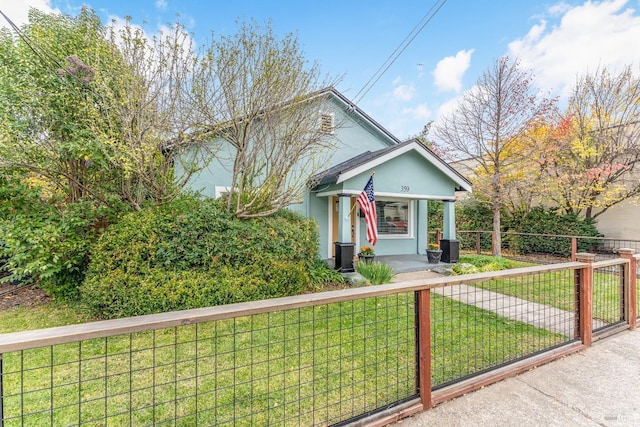 view of front of home featuring a front lawn and a porch