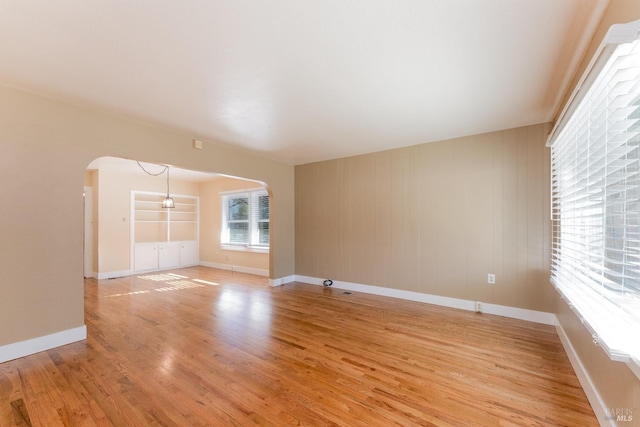 empty room with light hardwood / wood-style floors