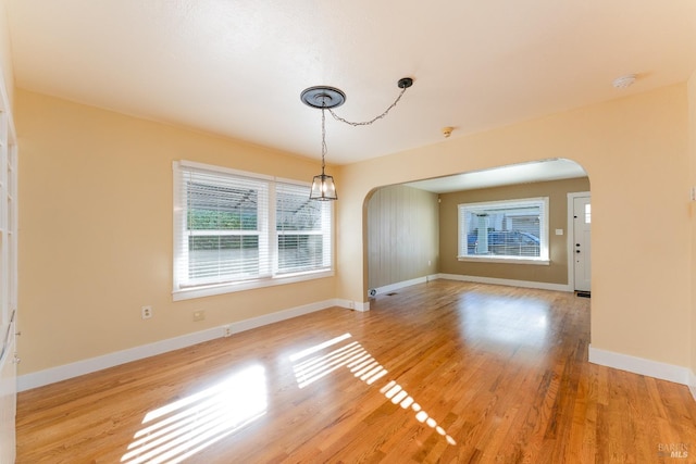 unfurnished dining area with light hardwood / wood-style flooring