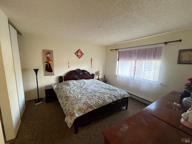 carpeted bedroom with a textured ceiling and baseboard heating