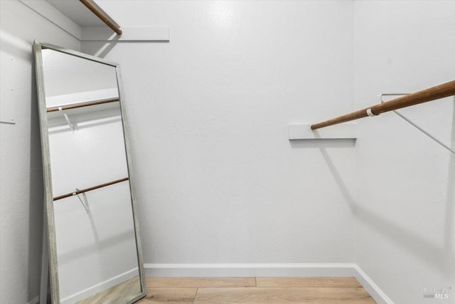 spacious closet with light wood finished floors