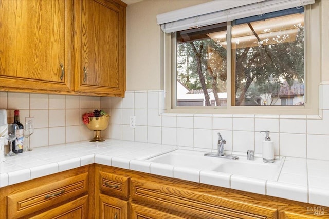 kitchen featuring backsplash and tile countertops