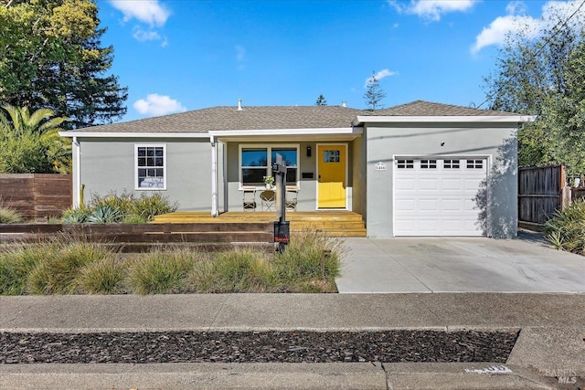 view of front of house featuring a porch and a garage