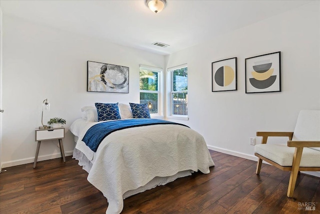 bedroom featuring dark hardwood / wood-style flooring