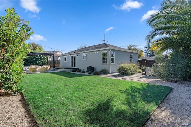 back of property with a yard, a patio, and a pergola