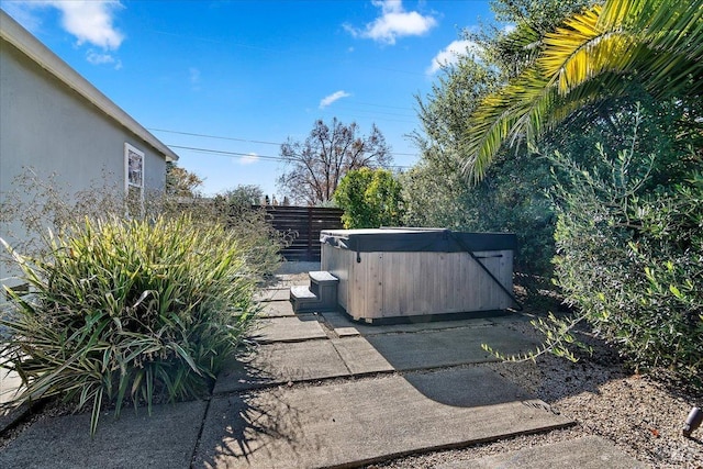 exterior space with a hot tub