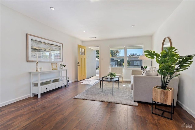 living room with dark hardwood / wood-style floors