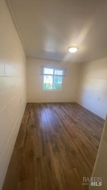 empty room featuring dark hardwood / wood-style floors