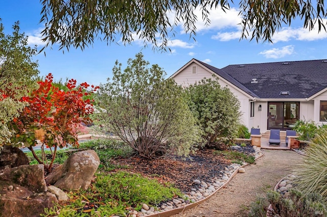 view of property exterior with a patio