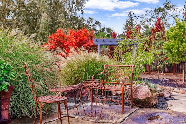 view of patio featuring fence