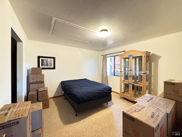 bedroom with access to exterior, light carpet, and a textured ceiling