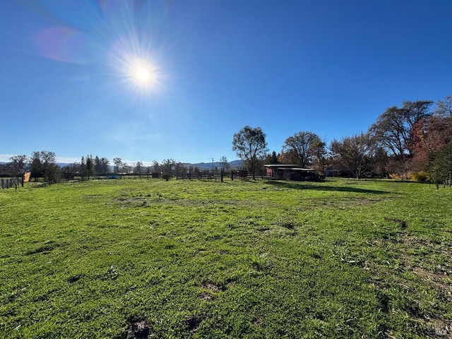 view of yard with a rural view