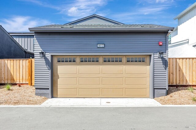 garage featuring fence