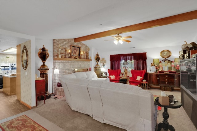 tiled living room featuring a ceiling fan, a fireplace, vaulted ceiling with beams, and baseboards