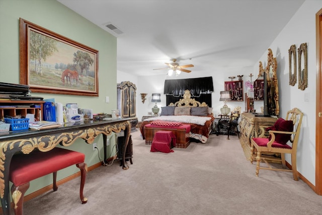 carpeted bedroom with a ceiling fan, visible vents, and baseboards