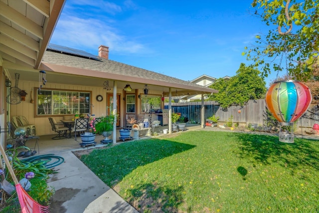 view of yard featuring a patio area and fence