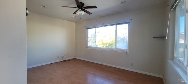 spare room featuring ceiling fan and light wood-type flooring