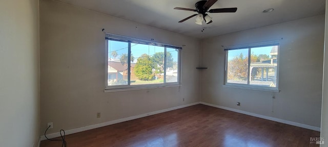 empty room featuring hardwood / wood-style floors and ceiling fan