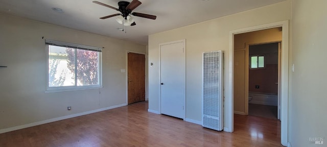 unfurnished bedroom featuring ceiling fan and light wood-type flooring