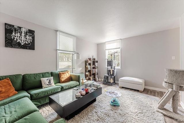 living room with plenty of natural light and wood-type flooring