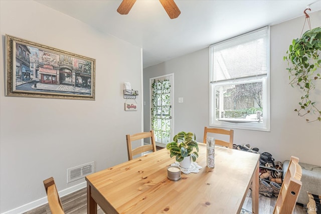 dining area featuring ceiling fan and wood-type flooring