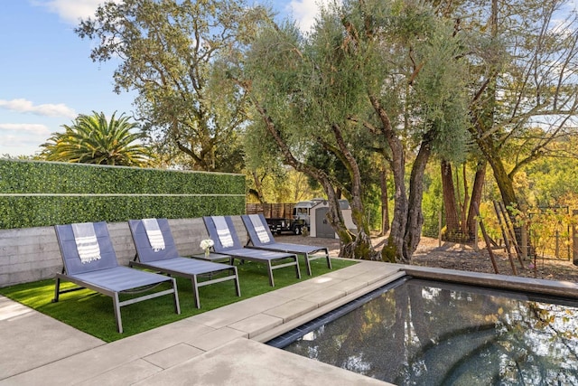 view of pool featuring a shed