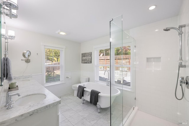 full bathroom featuring tile patterned flooring, vanity, toilet, and separate shower and tub