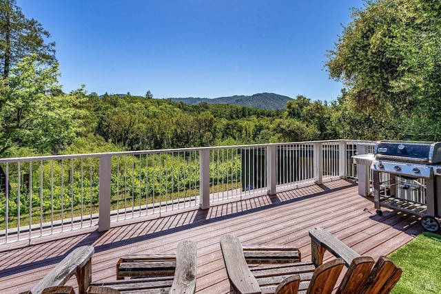 wooden deck with a mountain view