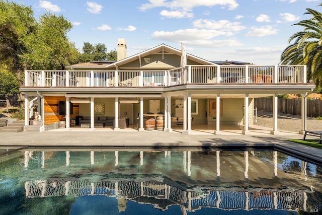 rear view of house with a patio and an outdoor hangout area