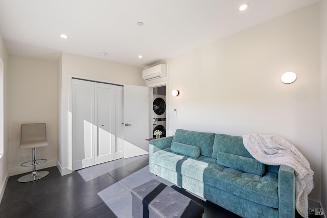 living room with a wall mounted air conditioner and stacked washer / drying machine