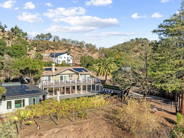 back of property featuring a balcony