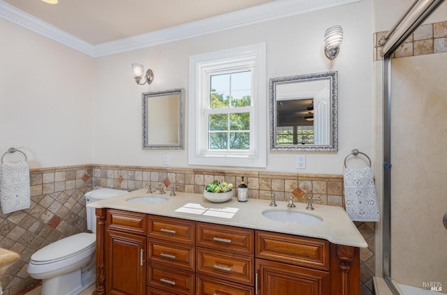 bathroom with walk in shower, vanity, tile walls, and ornamental molding